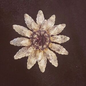 Vintage Gold Tone Sunburst Brooch with Amethyst Center Rhinestones